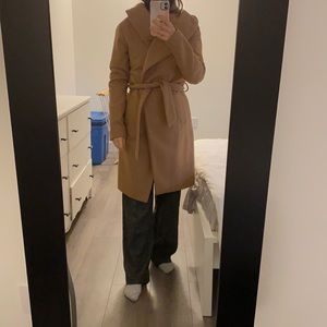 Beige wool trench coat with belt.